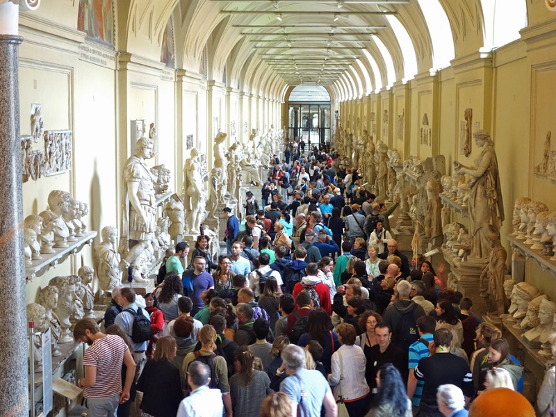 Visitors inside the Vatican Museums in Rome
